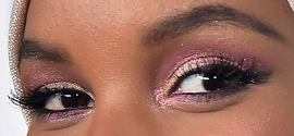 Picture of Halima Aden eyeliner, eyeshadow, and eyelash enhancements