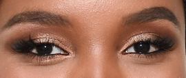 Picture of Halima Aden eyeliner, eyeshadow, and eyelash enhancements