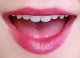 Picture of Kiernan Shipka's teeth while smiling