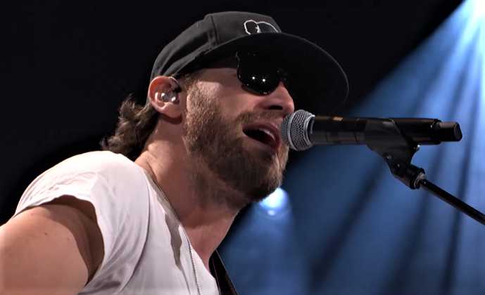 Chase Rice on stage at the Grand Opry