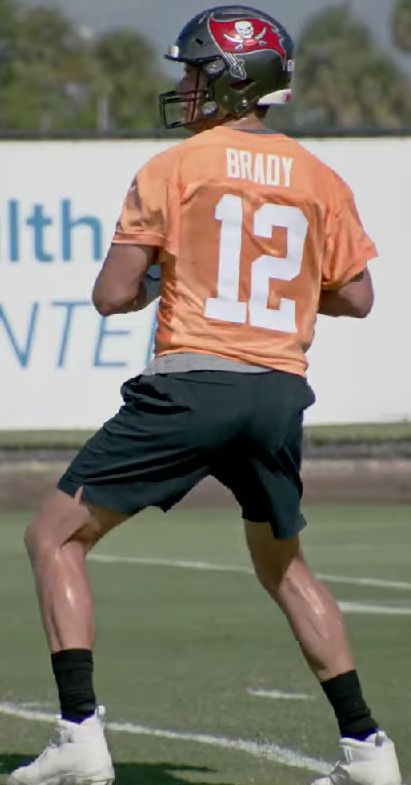 An image of Tom Brady throwing a pass - Bucs Offseason training.