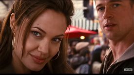 This is an image from Mr. and Mrs. Smith of Angelina Jolie, Brad Pitt with text that reads Mr. and Mrs. Smith